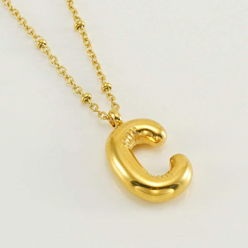 The gold letter C