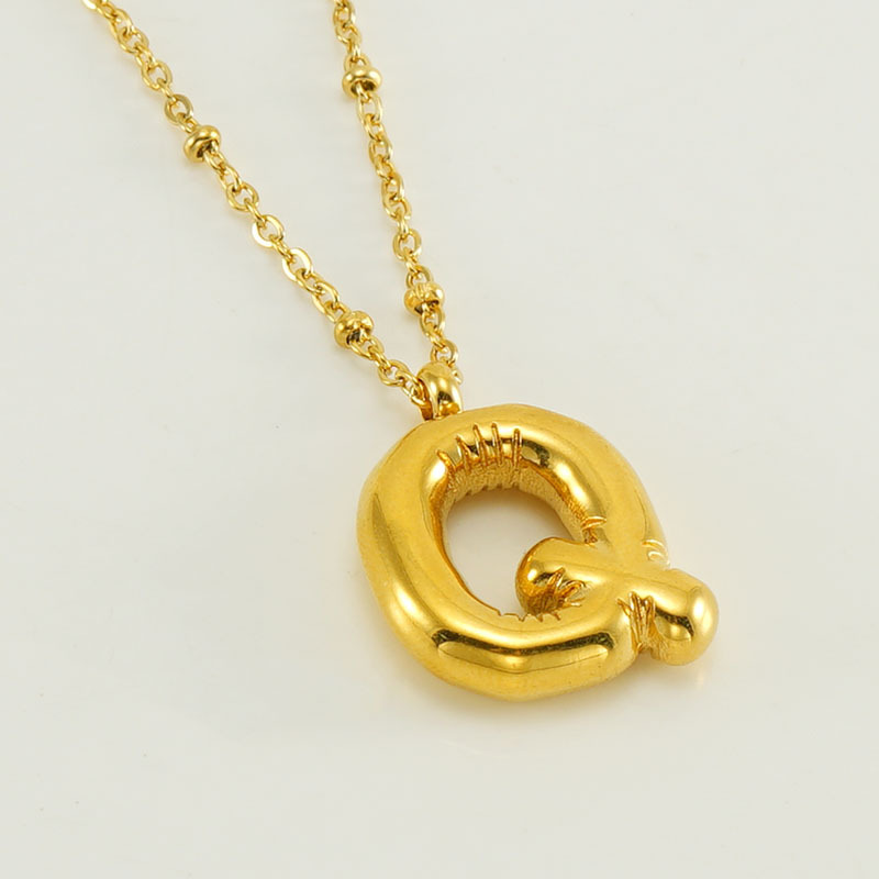The gold letter Q