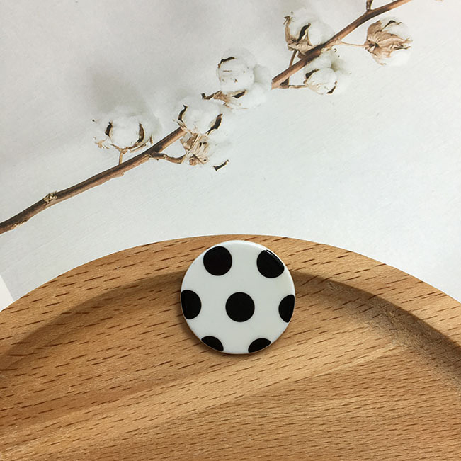 1:Black polka dots on white background