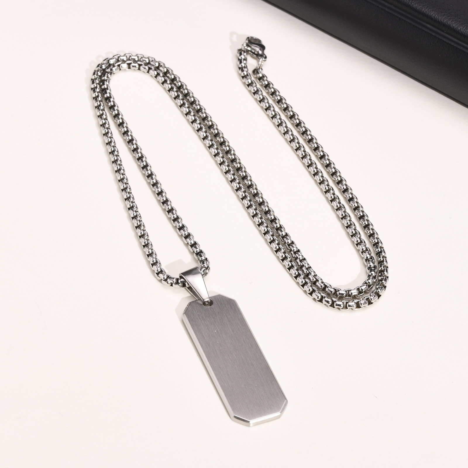 Steel colored pendant with chain