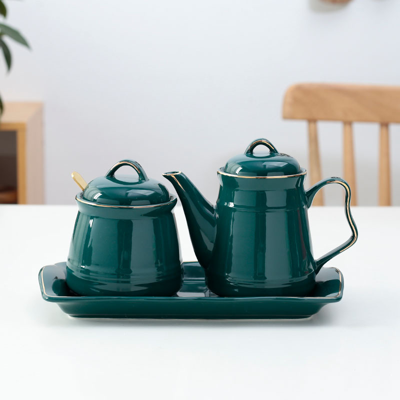 Drum-shaped dark green flavoring pot by pot by plate by spoonful