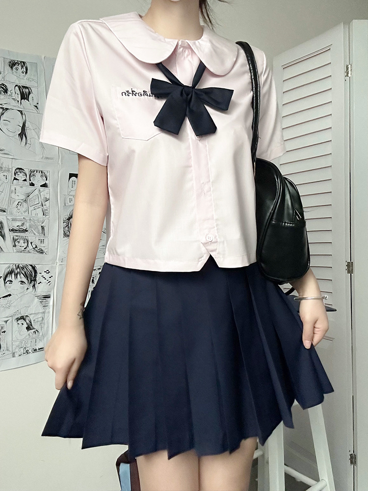 Pink shirt   navy pleated skirt   Navy blue bow tie