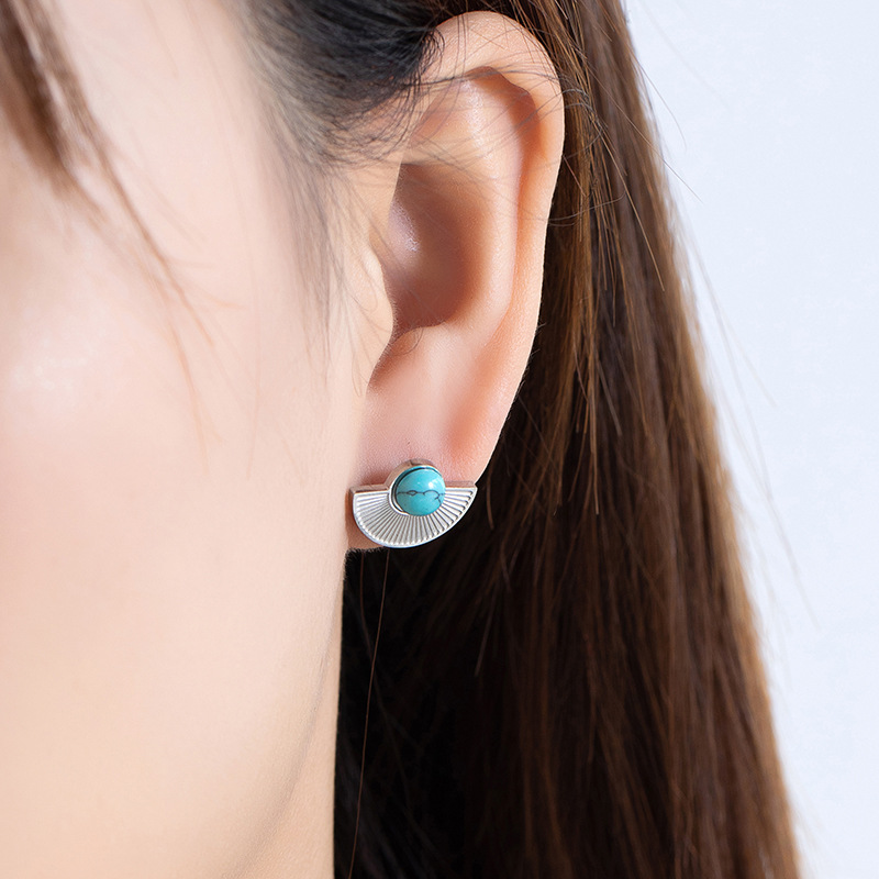 A pair of steel colored earrings