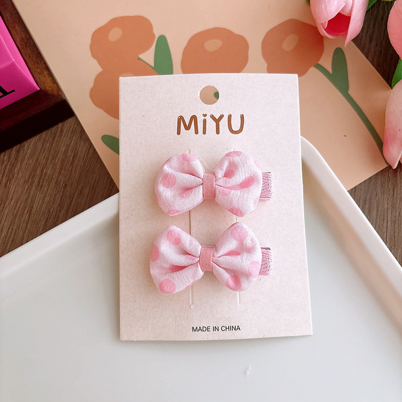 Polka dot bow hair clip