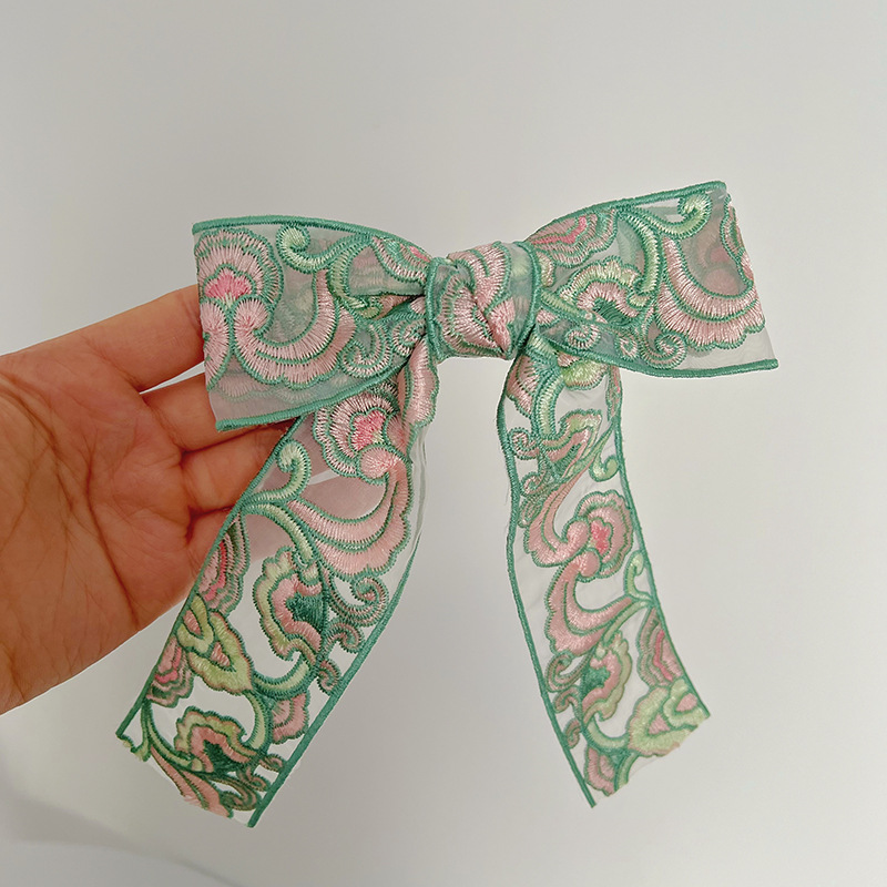Green embroidered bow hair clip
