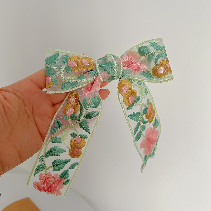 Greenish-pink embroidered bow hair clip