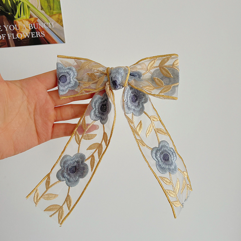 Yellow embroidered bow hair clip