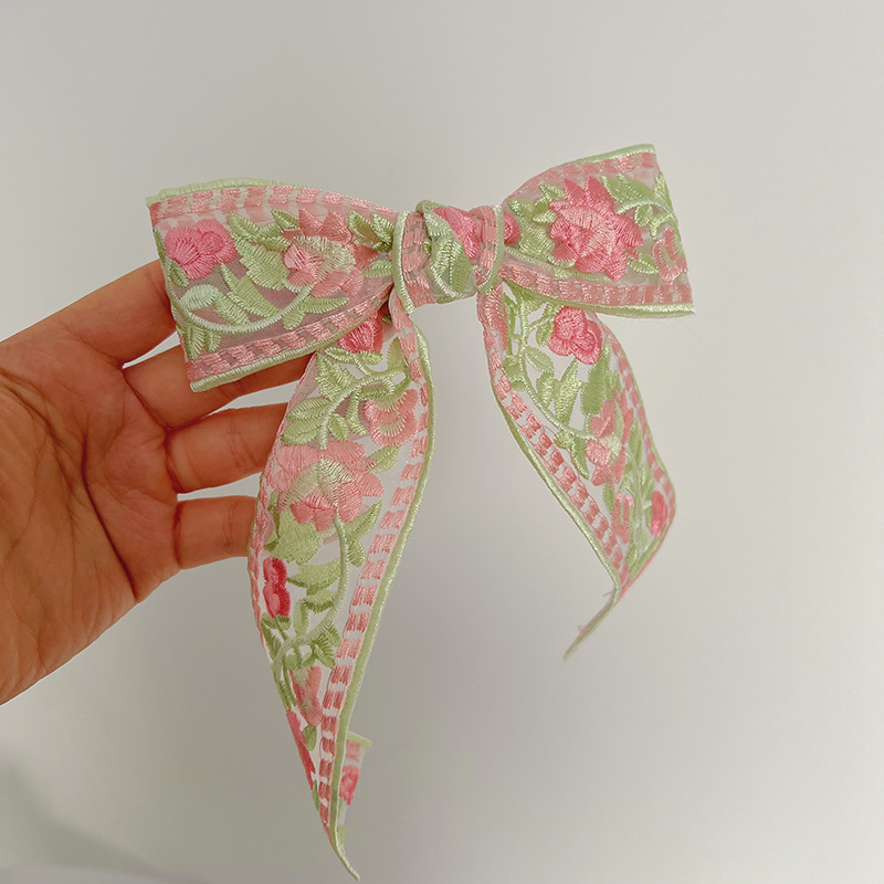 Pink embroidered bow hair clip