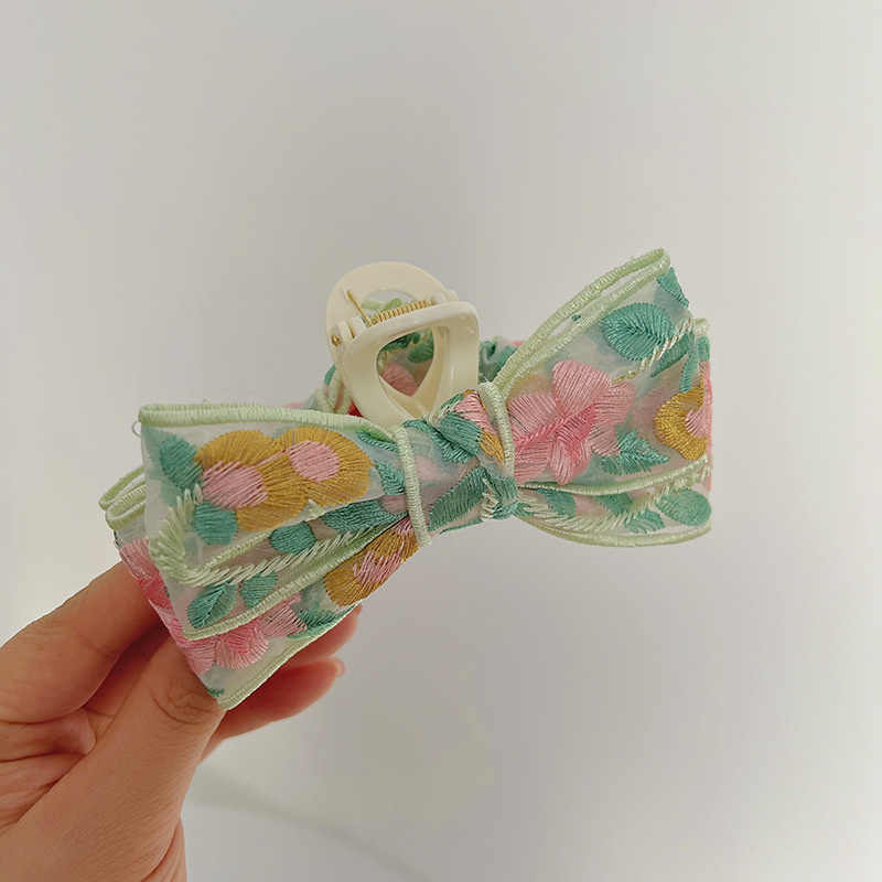 Green and pink embroidery bow clip