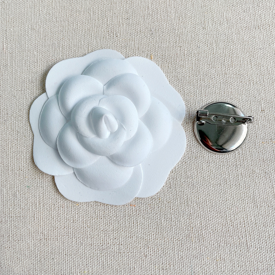 Small white brooch