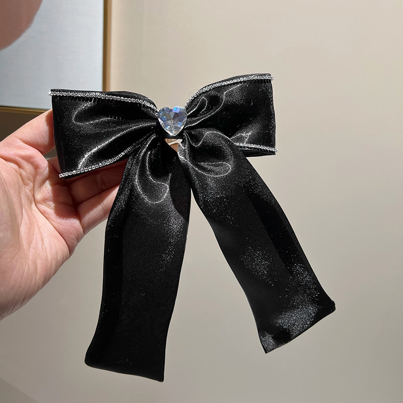 Black rhinestone bow hair clip