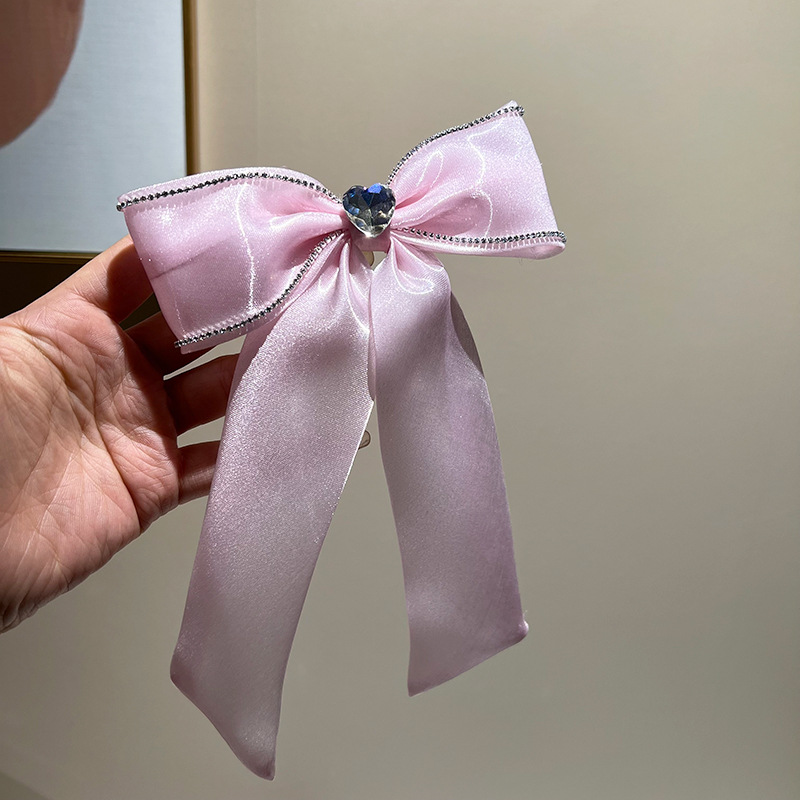 Pink rhinestone bow hair clip