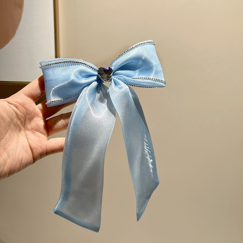 Blue rhinestone bow hair clip