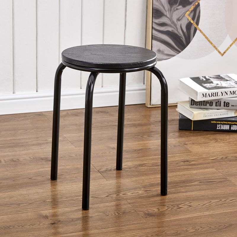 Black round tube with wooden stools