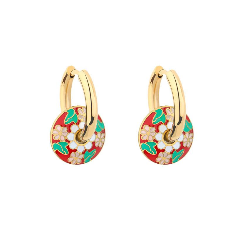 Earrings with pink flowers, green leaves and red background