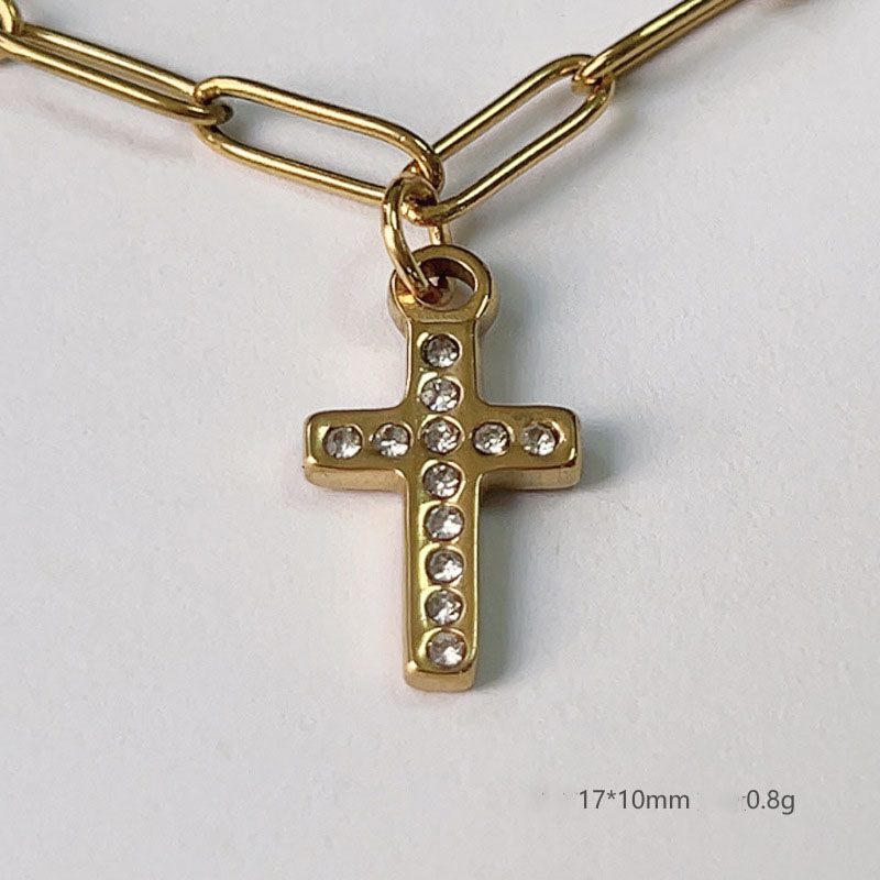 Cross inlaid diamond pendant