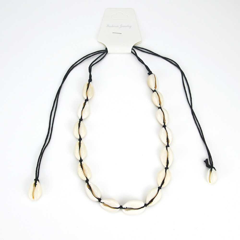 17 shells. - Black string necklace