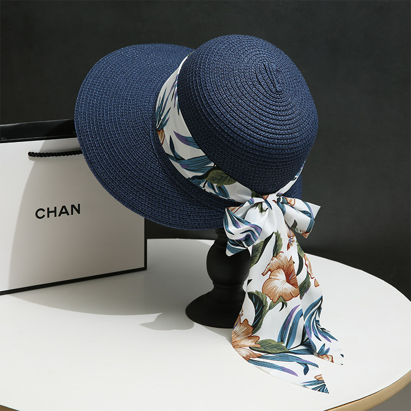 Navy blue straw hat with streamer