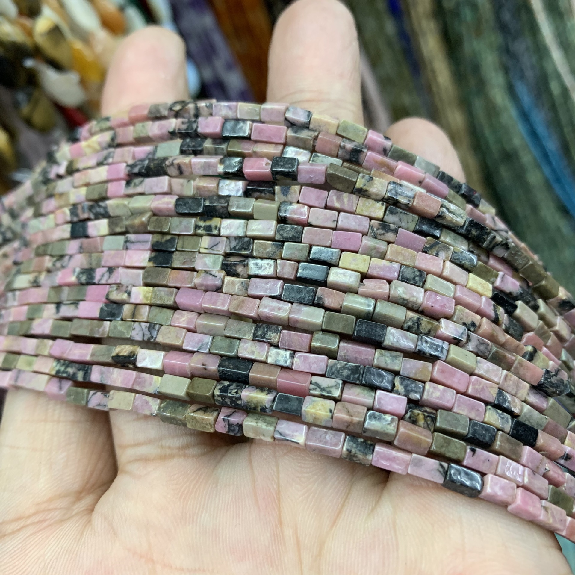 black stripes rhodonite stone