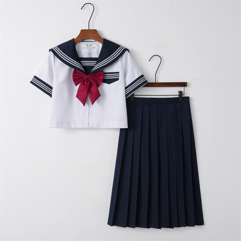 Short sleeve top   navy blue skirt   goldfish knot