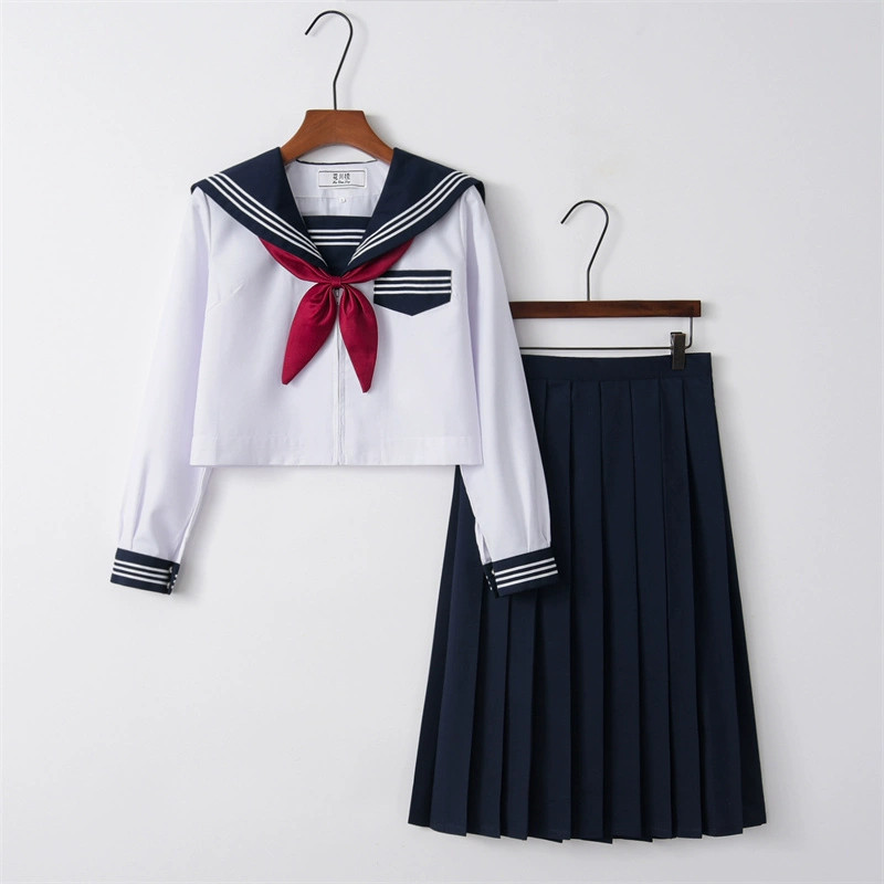 Long sleeve top   navy blue skirt   goldfish knot