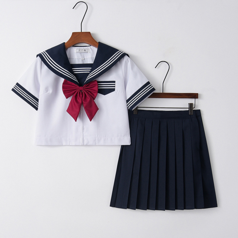 Short sleeve top   navy blue skirt   goldfish knot