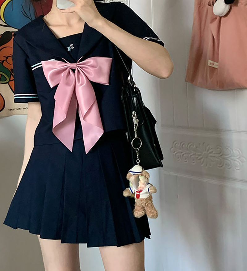 Short sleeve top   navy blue skirt   pink bow tie