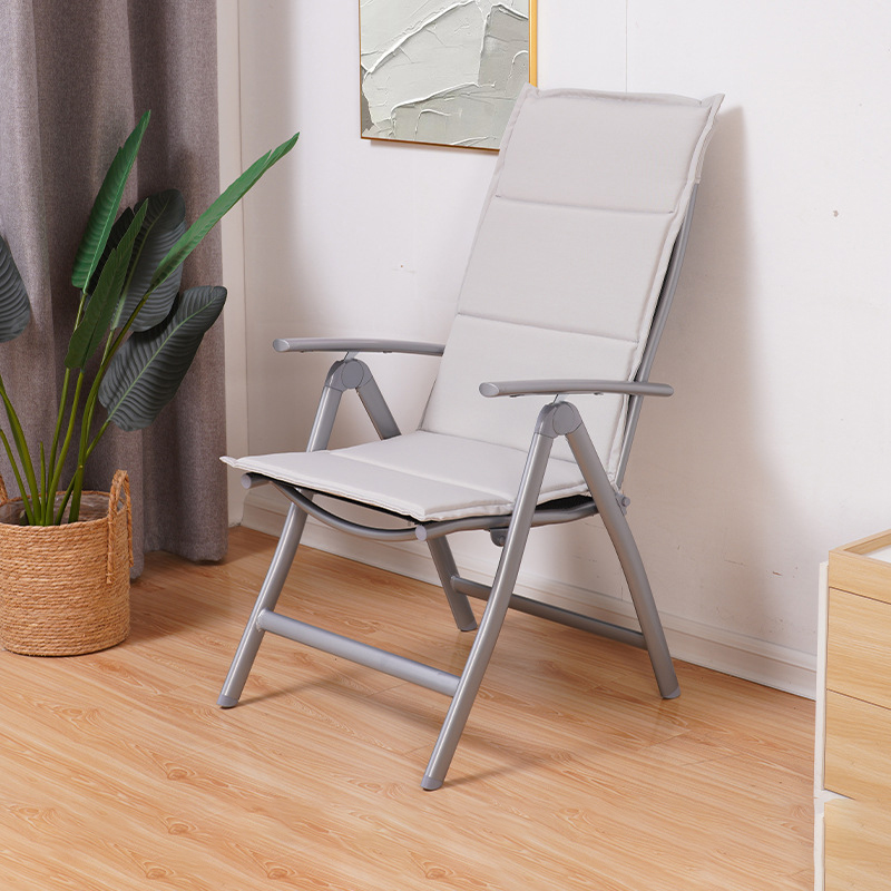 Folding chair with light grey cushion