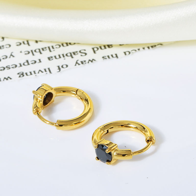 Gold with black zircon