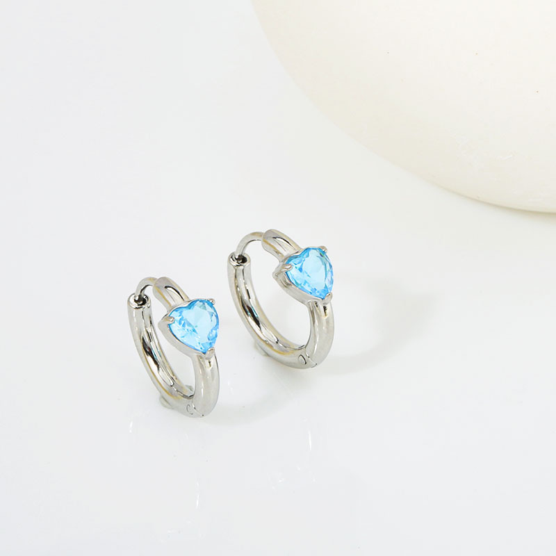 Set with light blue diamonds. - Silver stud earrings