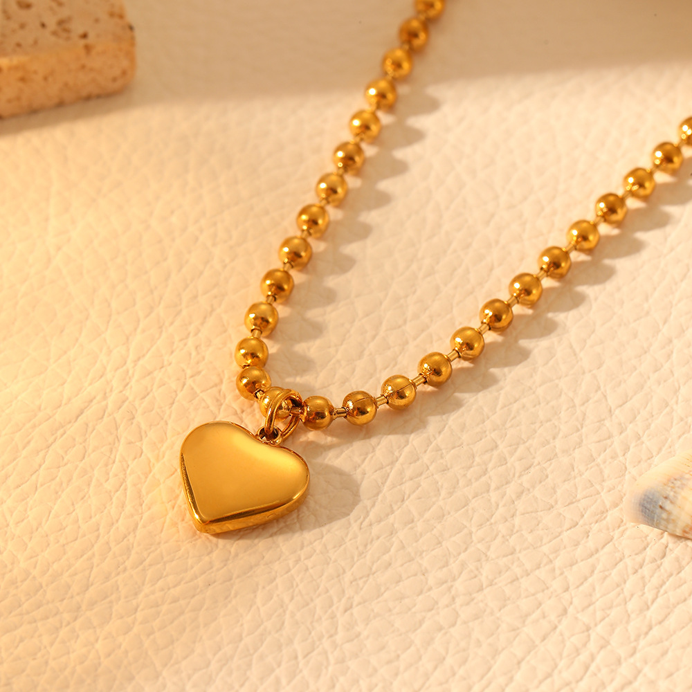 Gold wave bead necklace