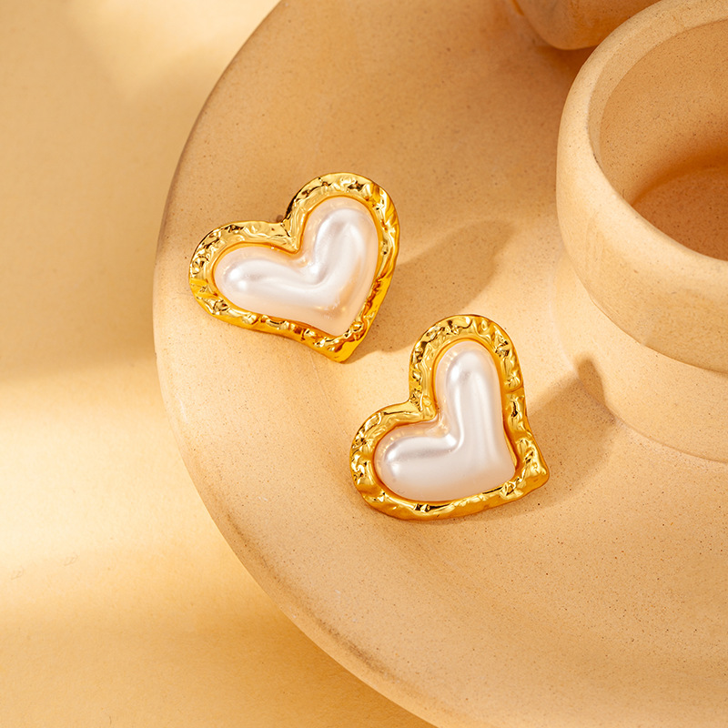 Love earrings with gold rim and white shell