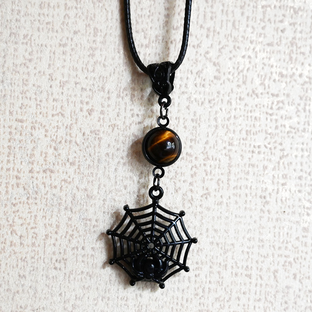 Dark tiger's eye stone spider web