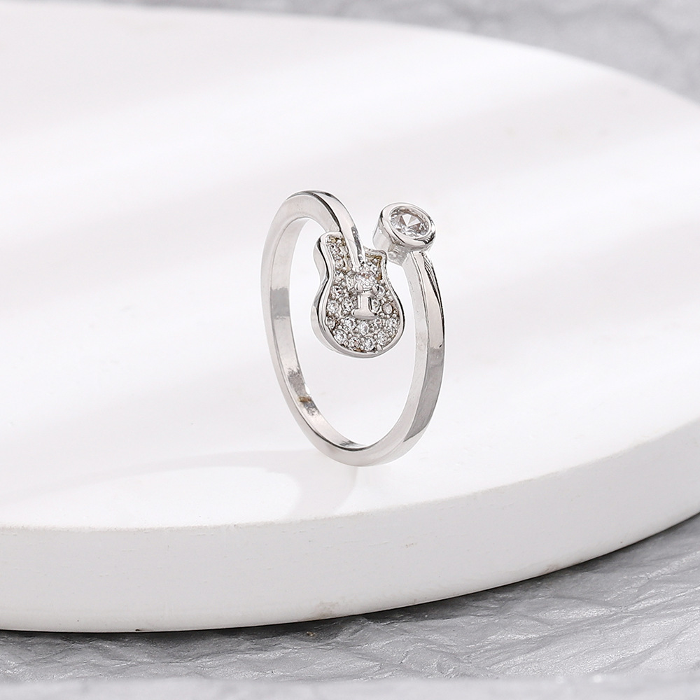 White Gold zircon guitar ring