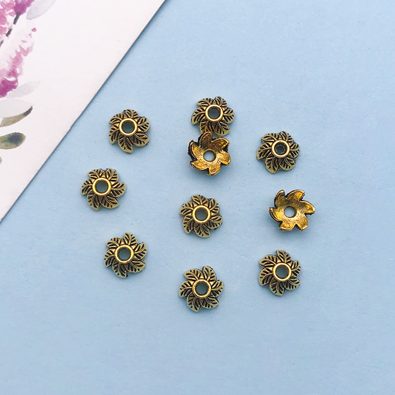 1 antique gold flower-shaped flower hat 7*7 holes 1.8 mm-16603-0.3g