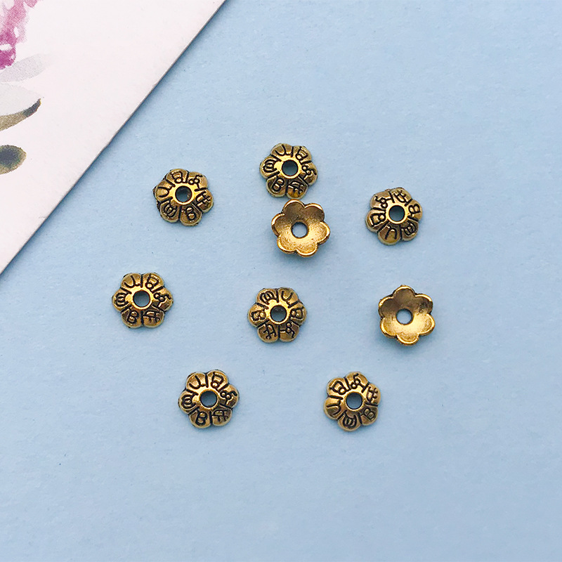 1 antique gold flower-shaped flower hat 5*5 holes 1.1 mm-16607-0.1g