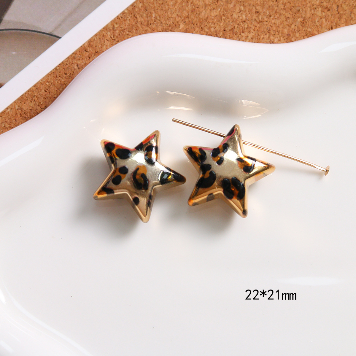 A rose gold perforated five-pointed star