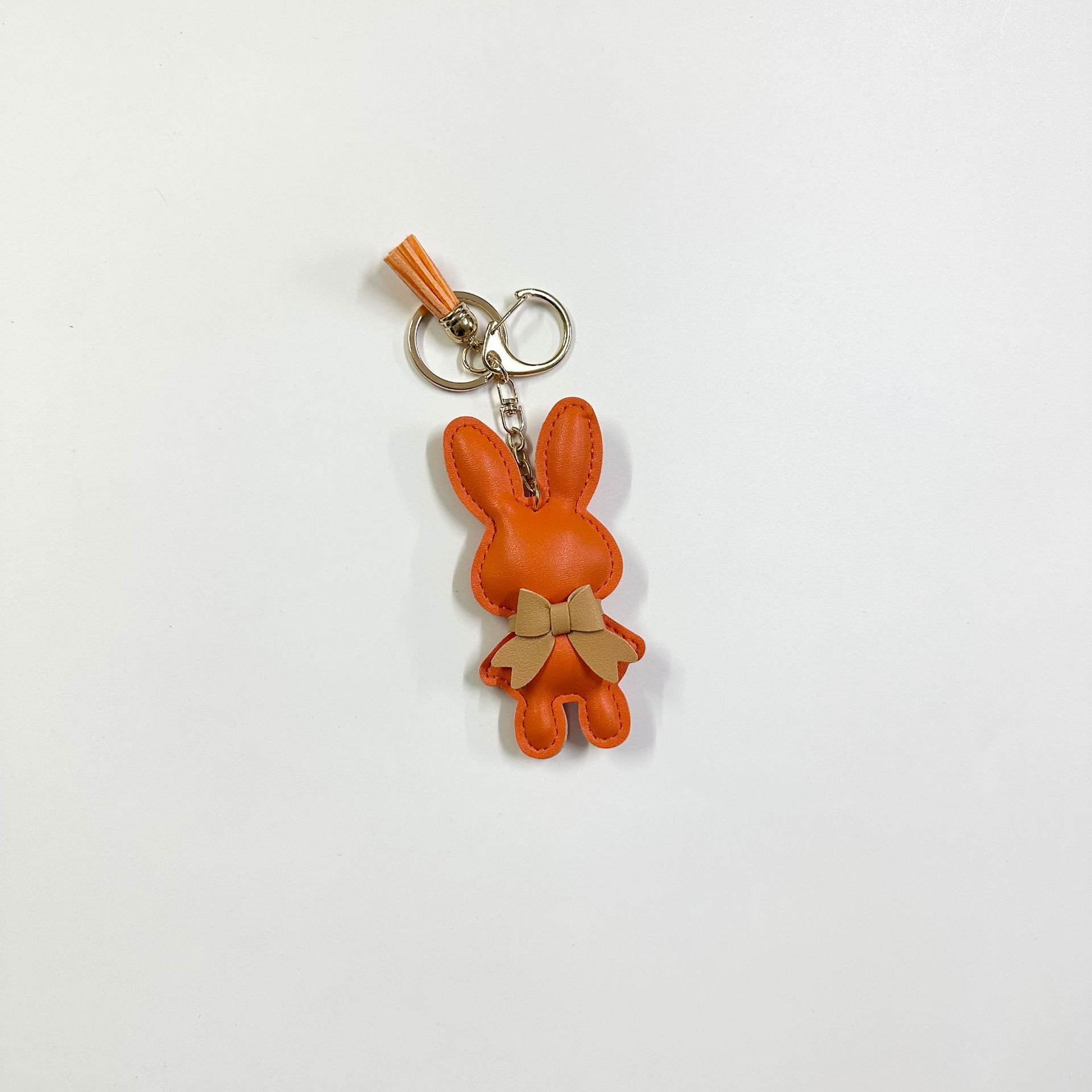 Orange rabbit with clasp tassel