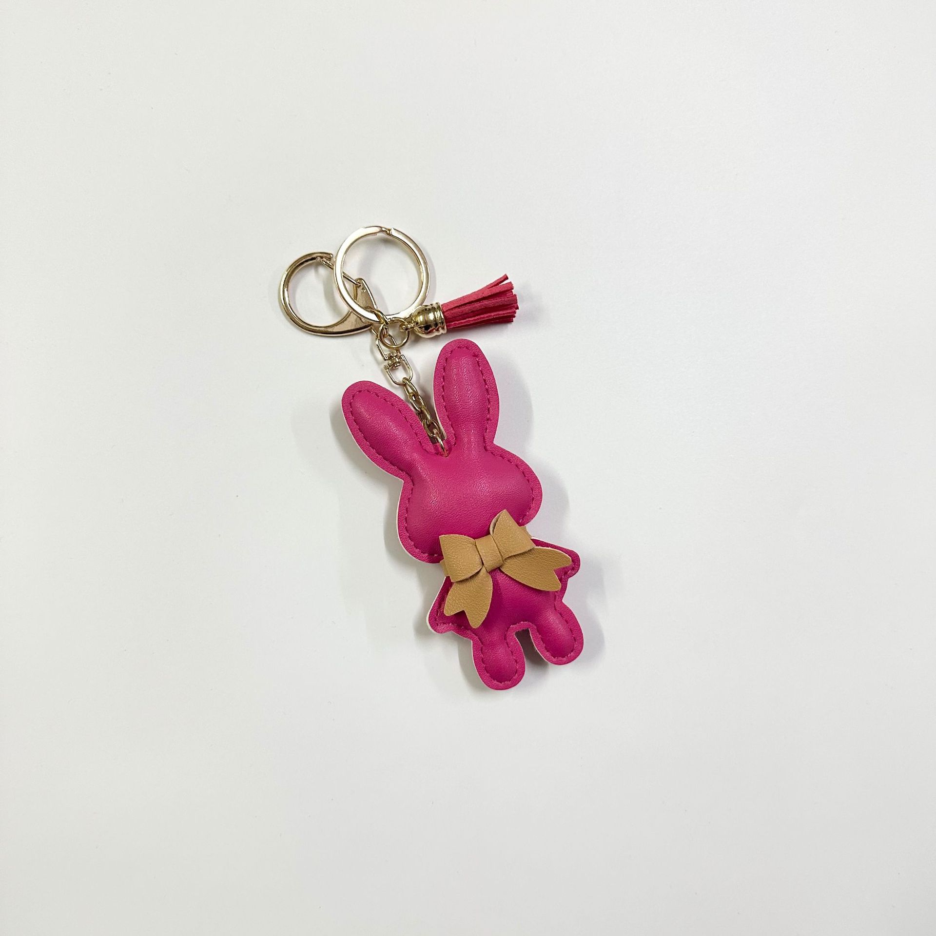 Rose red rabbit with button tassel