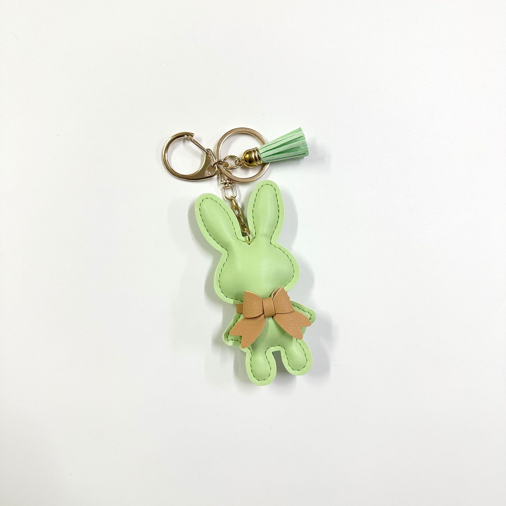 Grass green rabbit with button tassel