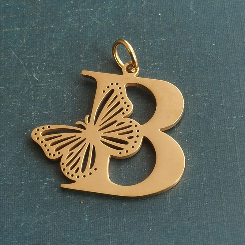 B gold pendant