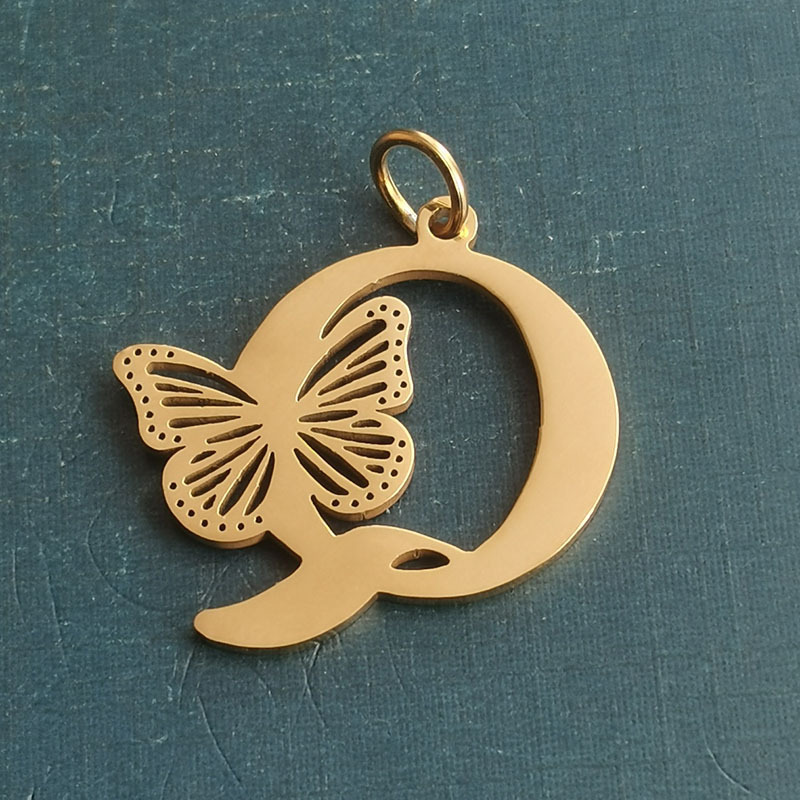 Q gold pendant