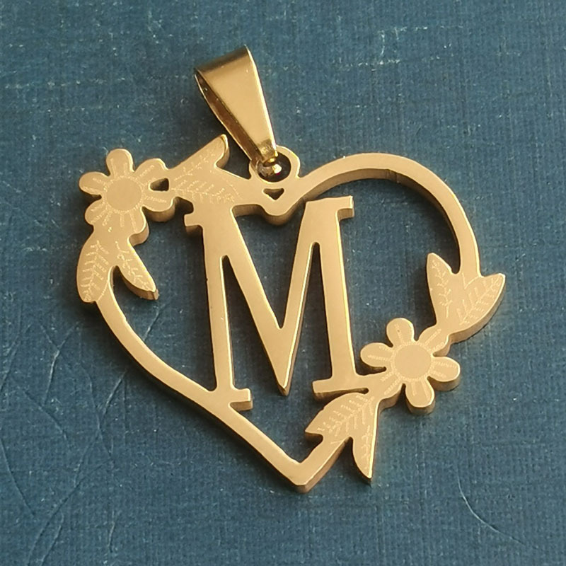 M gold pendant