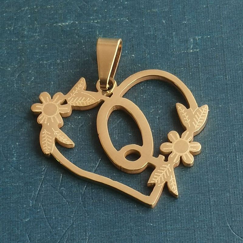 Q gold pendant