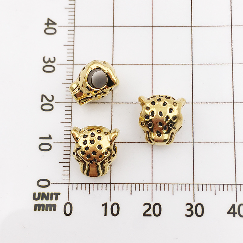 10115-antique gold leopard head-10x12-4mm