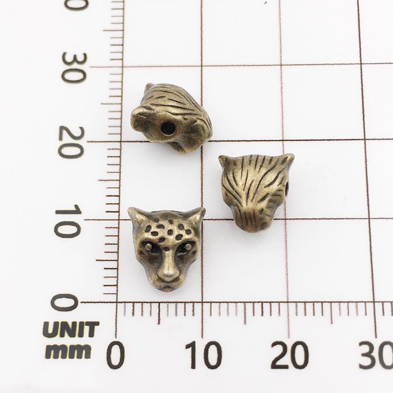 10120-antique  Bronze Leopard Head-9x10-1.5mm