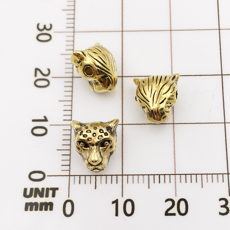 10121-antique gold leopard head-9x10-1.5mm