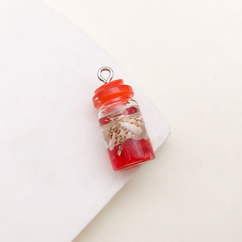 1 Red Conch drift bottle 10x24mm-17238