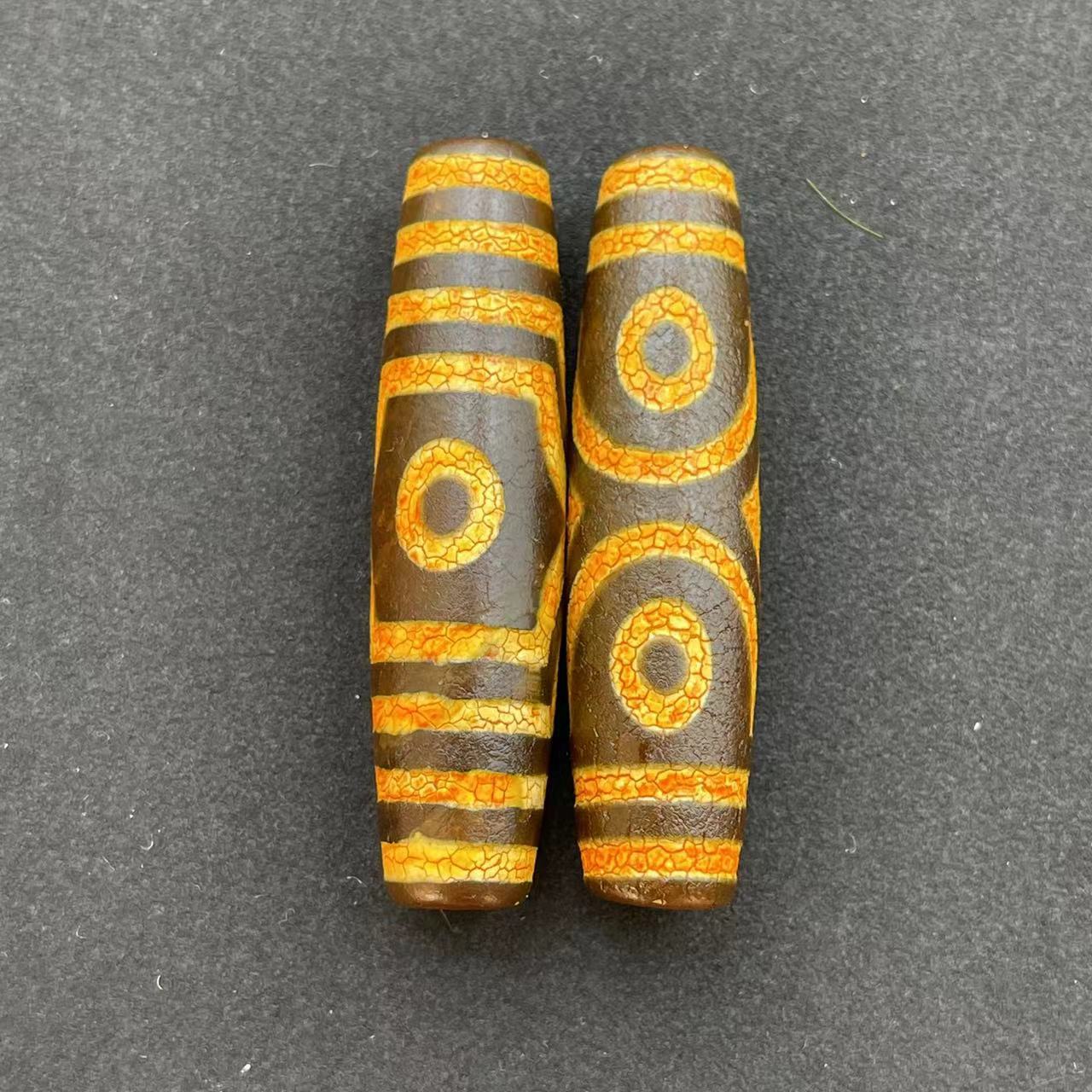 Three-eyed dzi beads