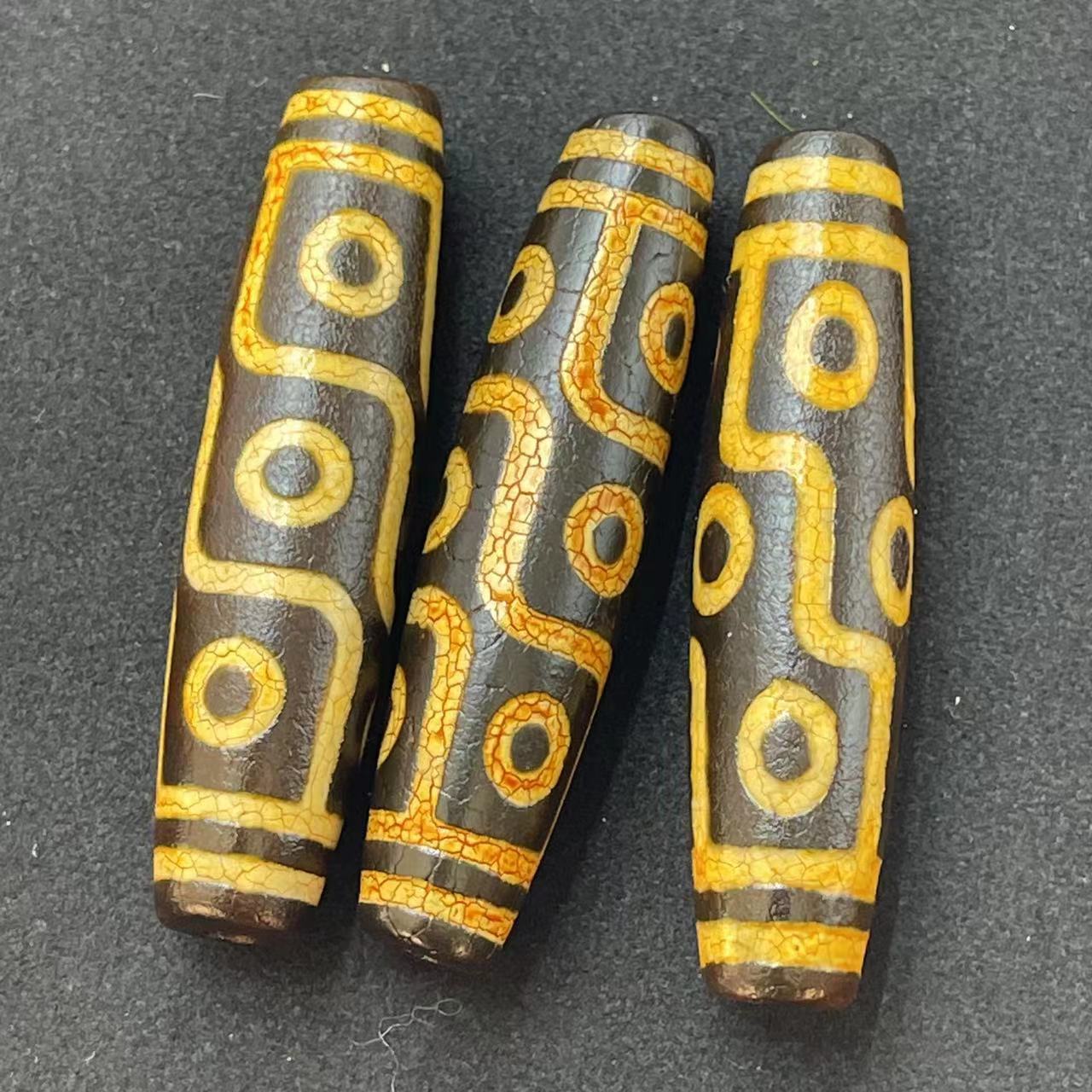 Nine-eyed dzi beads